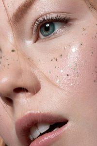 Alexandra Rayne of Devojka Models, close up with glitter freckles.