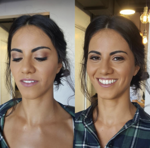 A brunette lady with soft glam makeup on smiling at the camera.